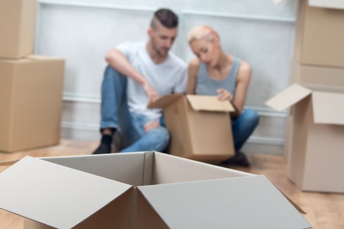 Local moving team loading furniture into a removals van