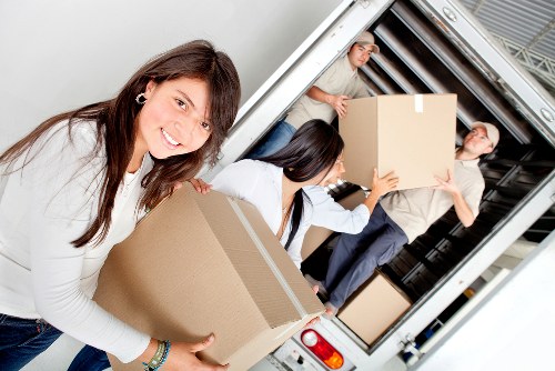 Local removal team handling boxes and household items