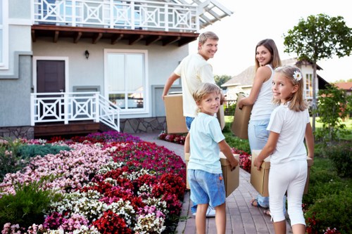 Professional movers handling furniture safely during a house move