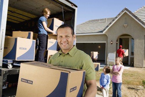 Professional movers handling household items carefully