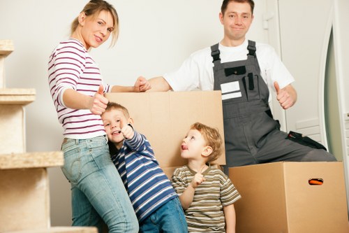 Loading furniture and boxes into a removal truck in Enfieldlock